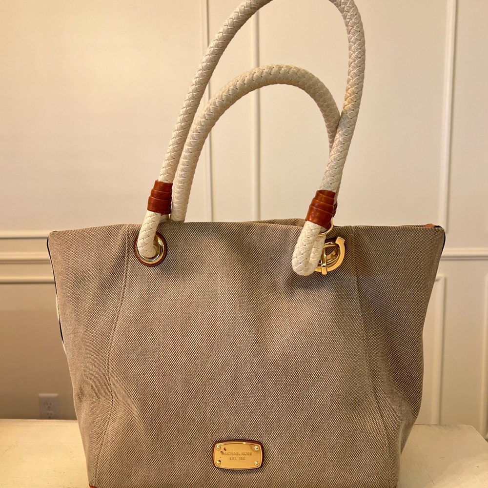 Michael Kors Beige Tote with Cream Rope Handles and gold details.